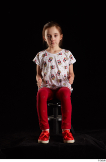 Lilly  1 dressed red leggings red shoes sitting t…